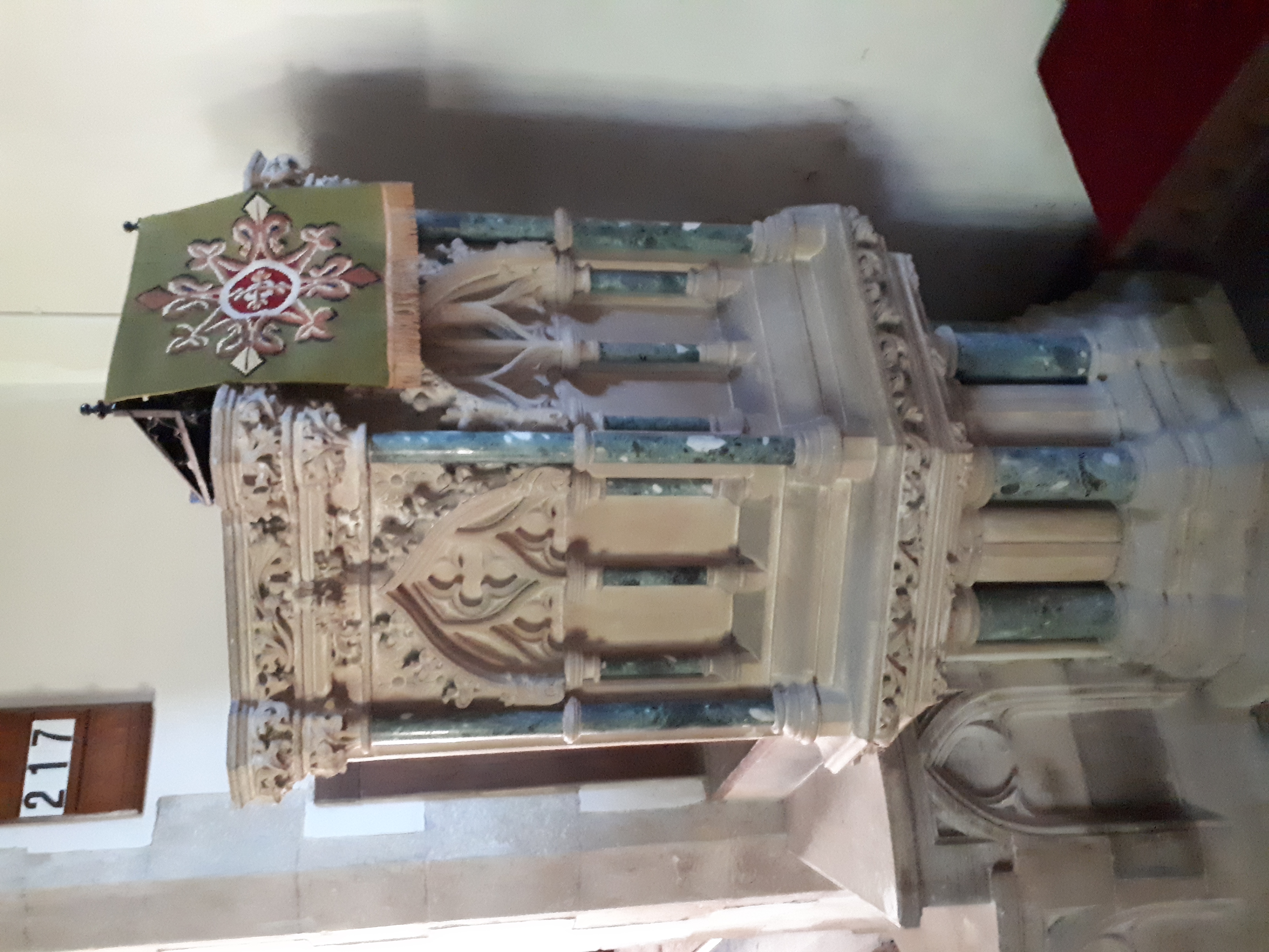 The ornate Victorian stone pulpit with marble shafts