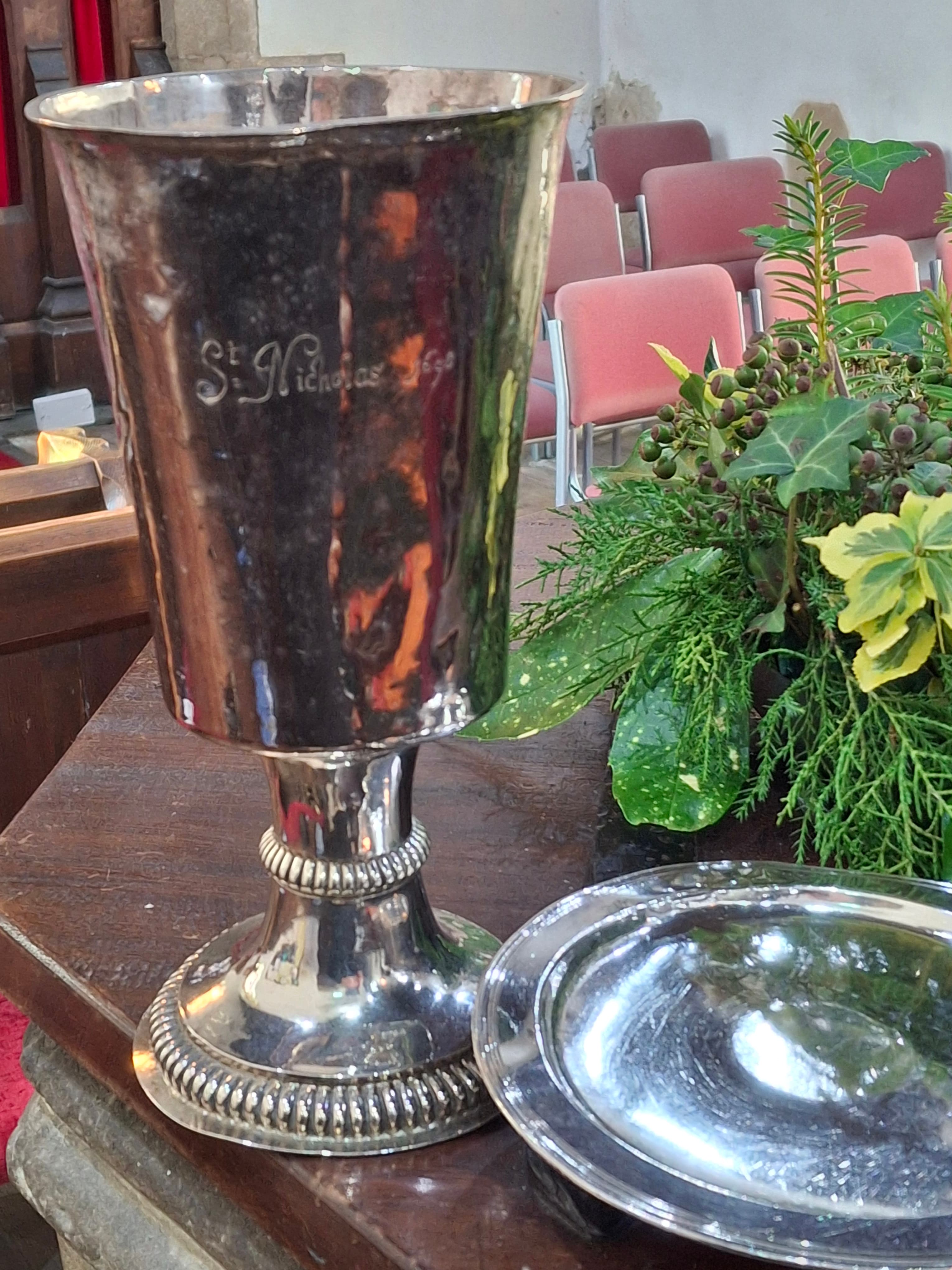 The silver communion chalice and paten of St Nicholas Church