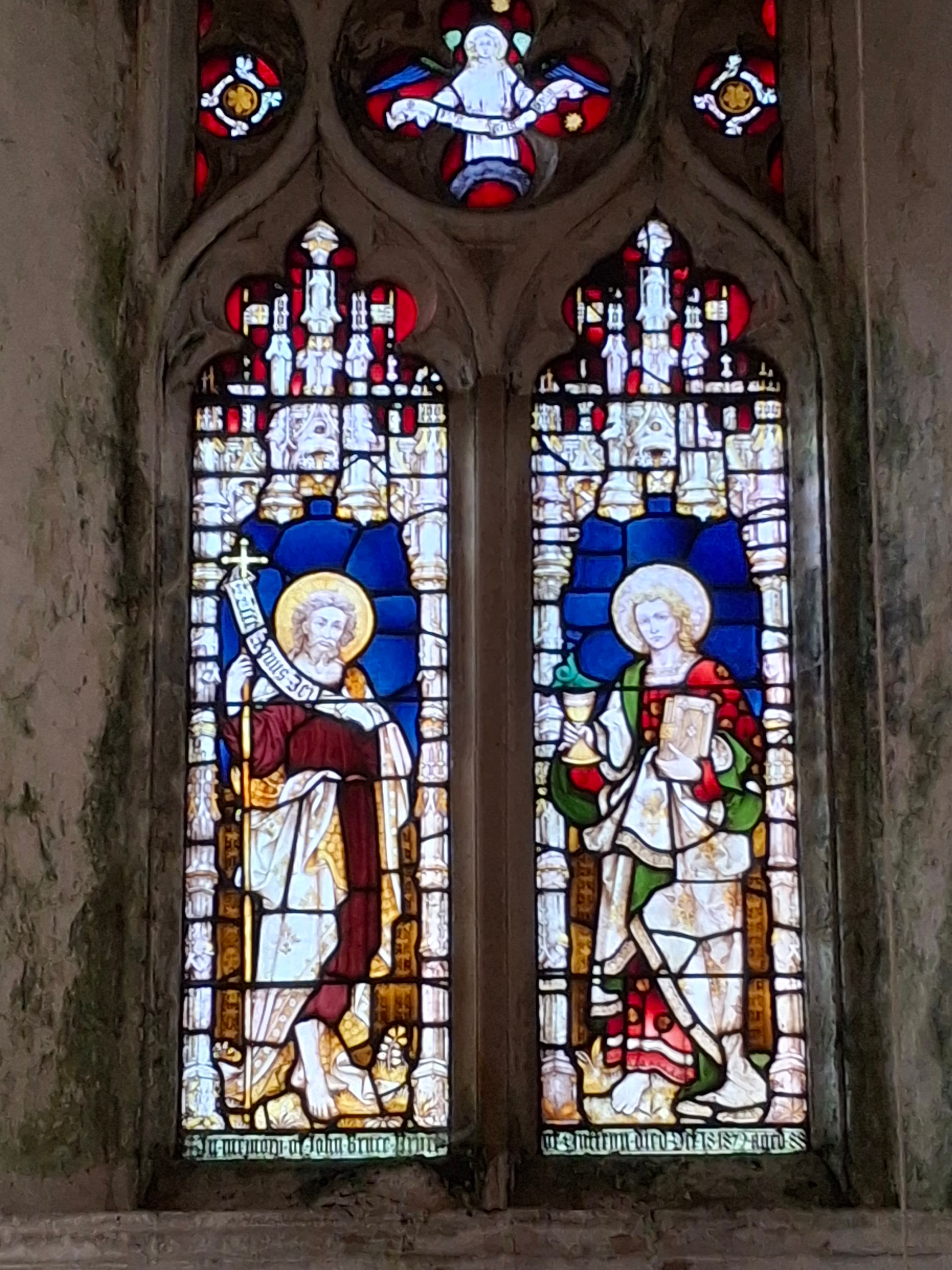 The tower window featuring St Peter and St John by Clayton & Bell