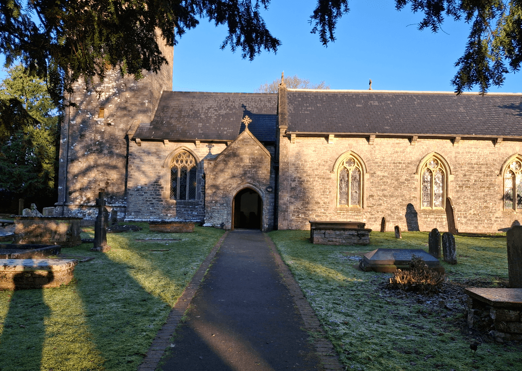 St Nicholas Church entrance bathed in golden light